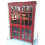 GLAZED BOOKCASE, Chinese style in red lacquer with three internal shelves on square supports,