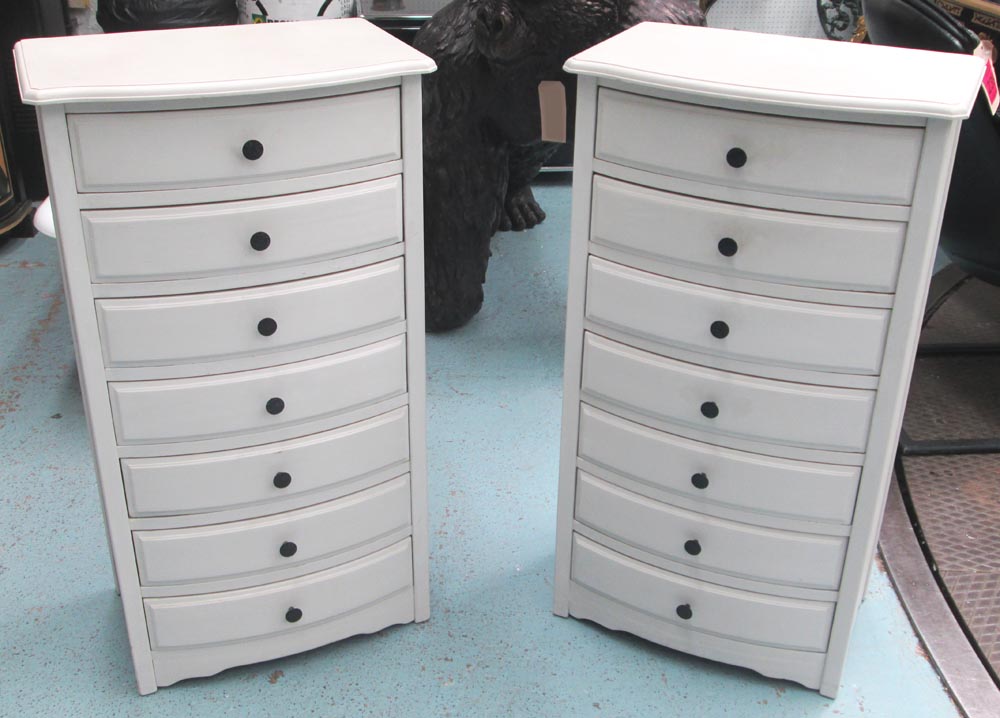 BOWFRONT CHESTS, a pair, painted, each with seven drawers, 96cm H x 52cm W x 36cm D.