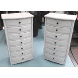 BOWFRONT CHESTS, a pair, painted, each with seven drawers, 96cm H x 52cm W x 36cm D.