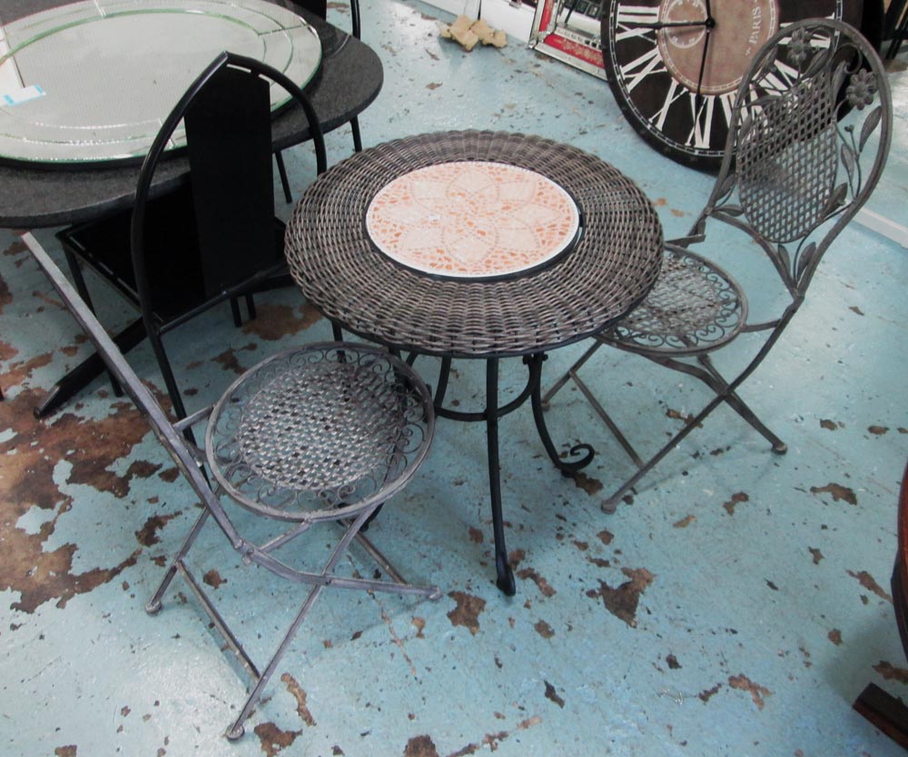 GARDEN SET, of one table and two chairs in iron and a woven top table, 62cm diam x 105cm H.