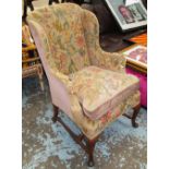 WINGARM CHAIR, early 20th century walnut of compact proportions in a tapestry finish,