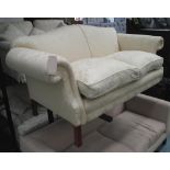 BANER SOFA, two seater, hump back in a cream floral fabric on square supports, 188cm L.