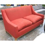 KINGCOMBE SOFA, with red upholstery and polished wooden legs, 184cm W x 89cm D x 102cm H.