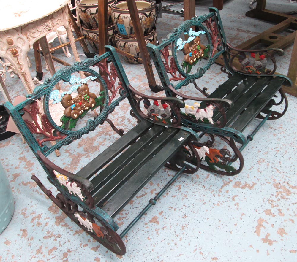 CHILDREN'S GARDEN CHAIRS, a pair, distressed iron with wooden seat on a rocking base, 42cm W.