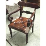 DESK ELBOW CHAIR, George IV mahogany with a leaf carved and roundel centred crossbar,