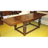 DRAWLEAF REFECTORY TABLE, 19th century Elizabethan style oak on leaf carved cup and cover legs,