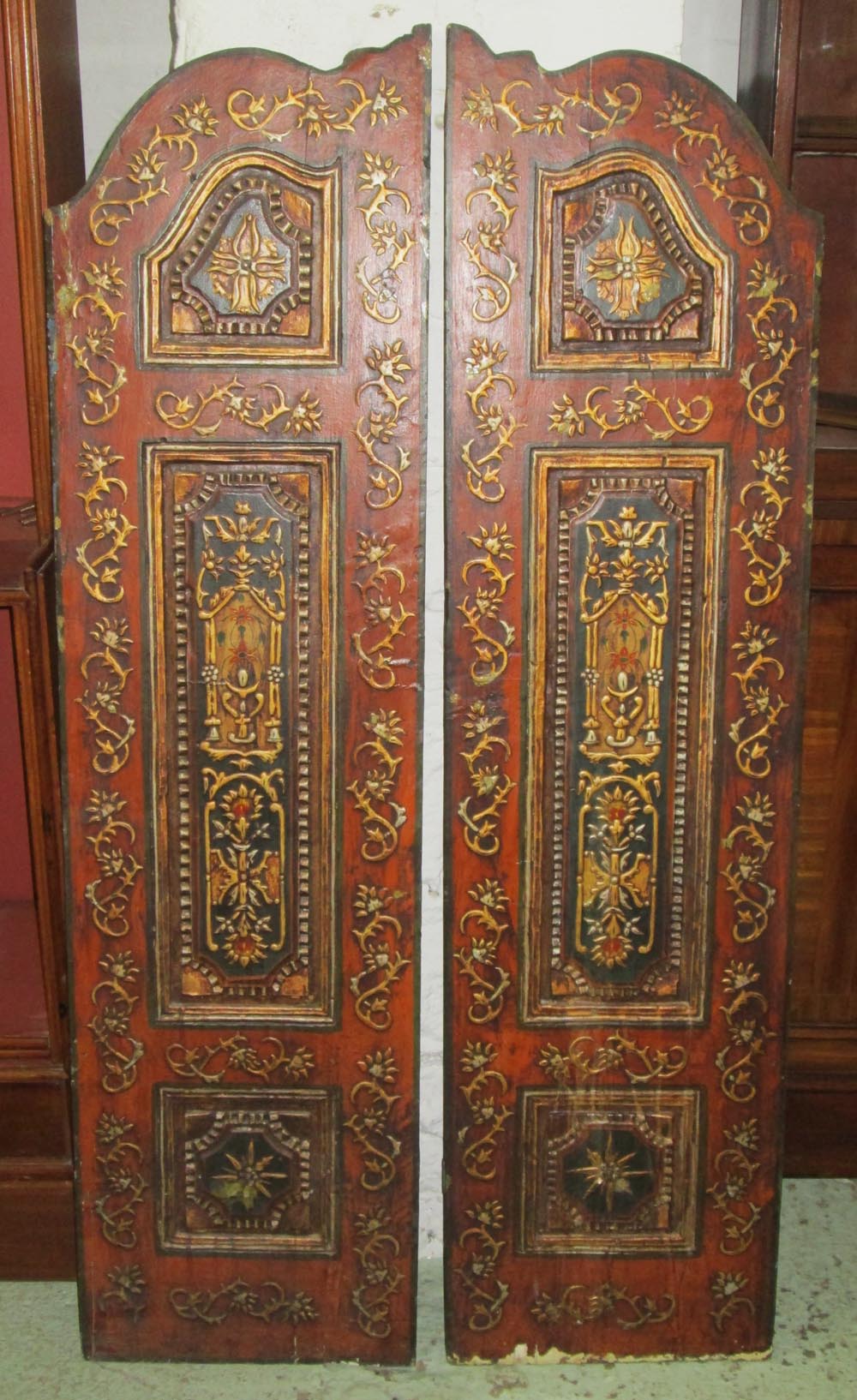 DOOR PANELS, a pair, 19th century continental polychrome gesso and pine of arched form,