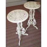GARDEN TABLES, a pair, in distressed white painted metal, 71cm H x 36cm diam.