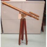 TELESCOPE, with sight in coppered finish on extendable wooden tripod supports, 160cm H.