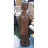 SCULPTURE, of a female, carved from solid elm, 129cm H.