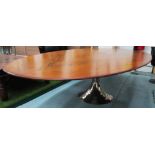 JULIAN CHICHESTER DINING TABLE, with an oval rosewood top on a tulip base,
