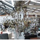 CHANDELIER, tole peinte and ceramic rose decorated of twelve branches with thirteen lights,