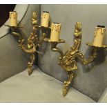 WALL SCONCES, a pair, Rococo style, gilt metal, 31cm H.
