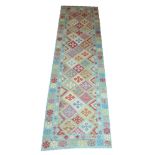 ANATOLIAN KILIM RUNNER, 286cm x 83cm, geometric motifs on a duck egg blue ground.