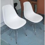 DINING CHAIRS, a set of four, in white resin on chromed metal supports, 47cm.