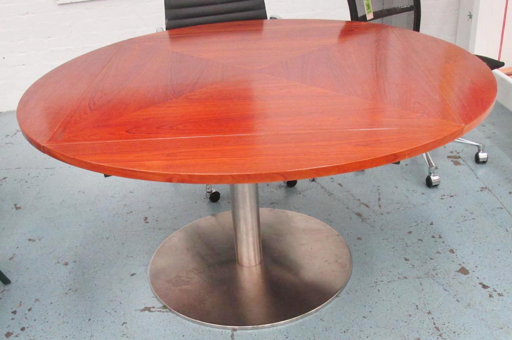 DINING TABLE, extending circular with four fold down flaps on a steel base, 151cm diam x 74cm H.