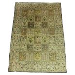 QUM PART SILK RUG, 157cm x 112cm, garden design motifs on an ivory field within a palmette border.