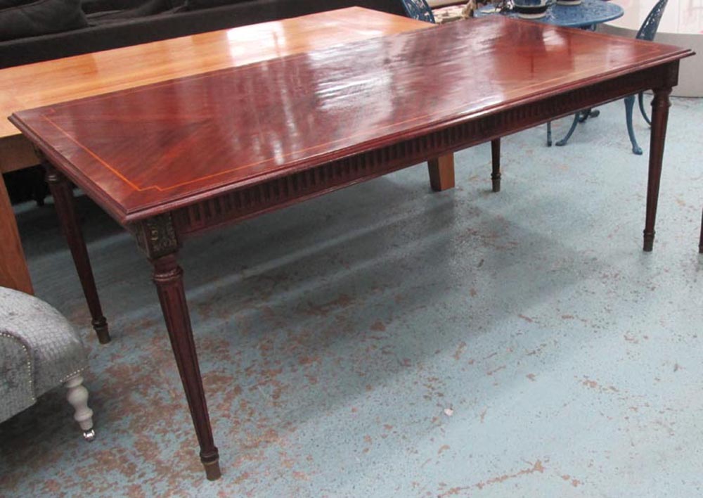 DINING TABLE, French style in mahogany finish with satinwood inlay on turned fluted supports,