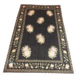 VINTAGE SPANISH CARPET, 245cm x 150cm, Bessarabian design on a noir field within a floral border.