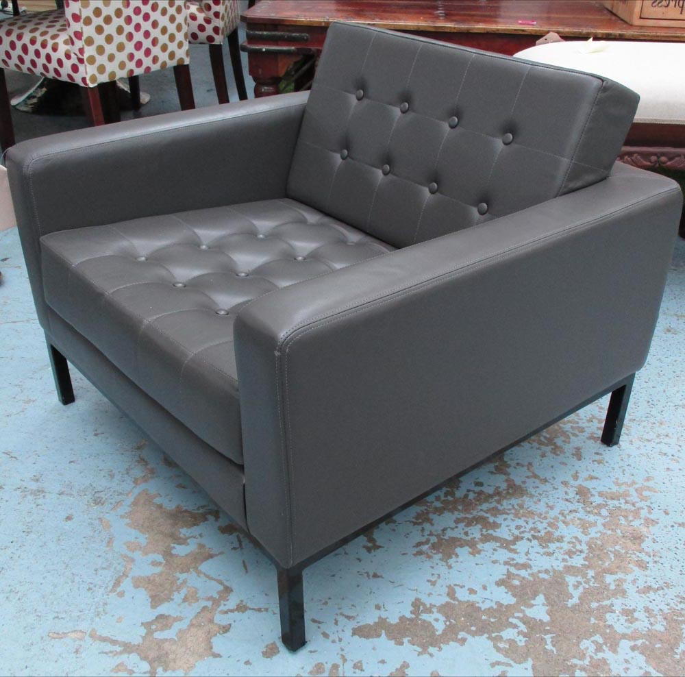 ROBIN DAY ARMCHAIR, in buttoned grey leather on black metal supports, 80cm x 80cm x 72cm H.