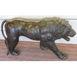 PROWLING LION, 20th century, leather clad, 112cm nose to tail.