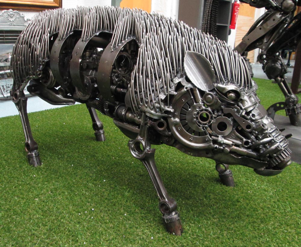 WARTHOG MODEL, made from welded machine parts, 63cm H x 40cm W x 127cm L.