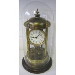 ANNIVERSARY CLOCK, of pagoda design, the German movement with torsion pendulum, under glass dome,