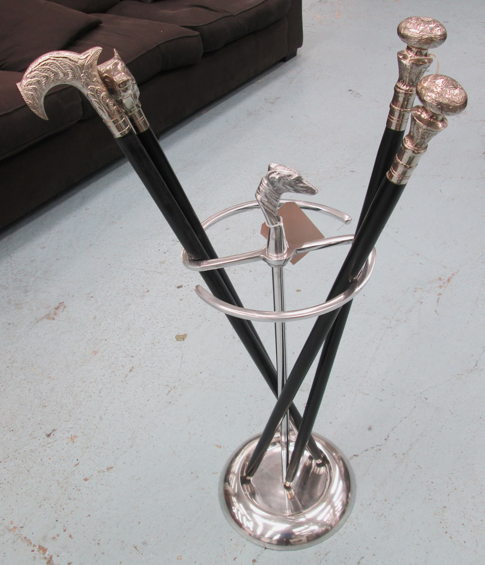 STICK STAND, in a chromed metal finish with dog finial plus set of four walking sticks, 95cm H.