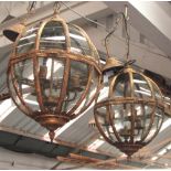 CEILING LIGHTS, a pair, globe style in gilded metal frames, 62cm H, plus chain.