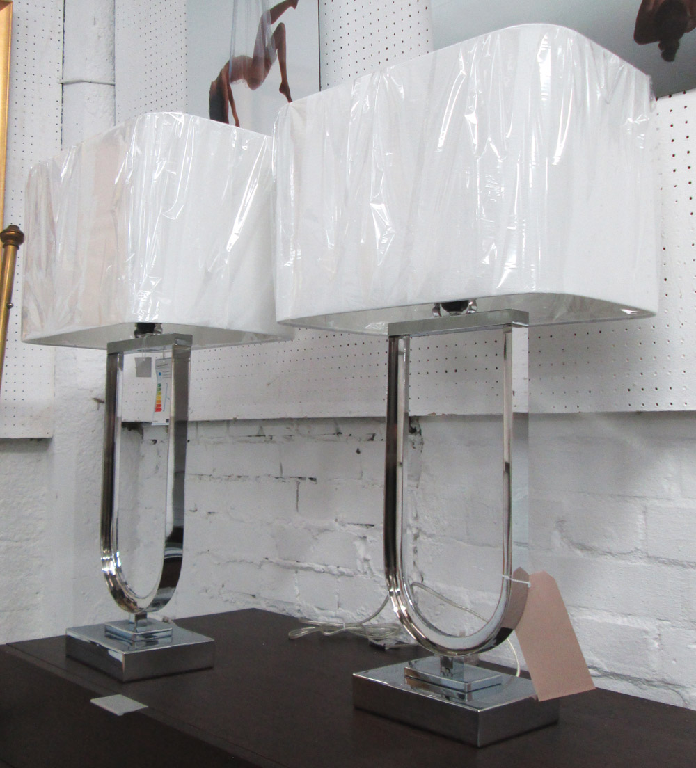 TABLE LAMPS, a pair, Art Deco style, in chromed metal with shades, 75cm H.