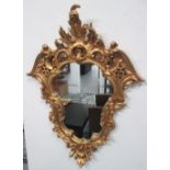 MIRRORS, a pair, Louis XV style, in gilded frame, 90cm x 67cm.