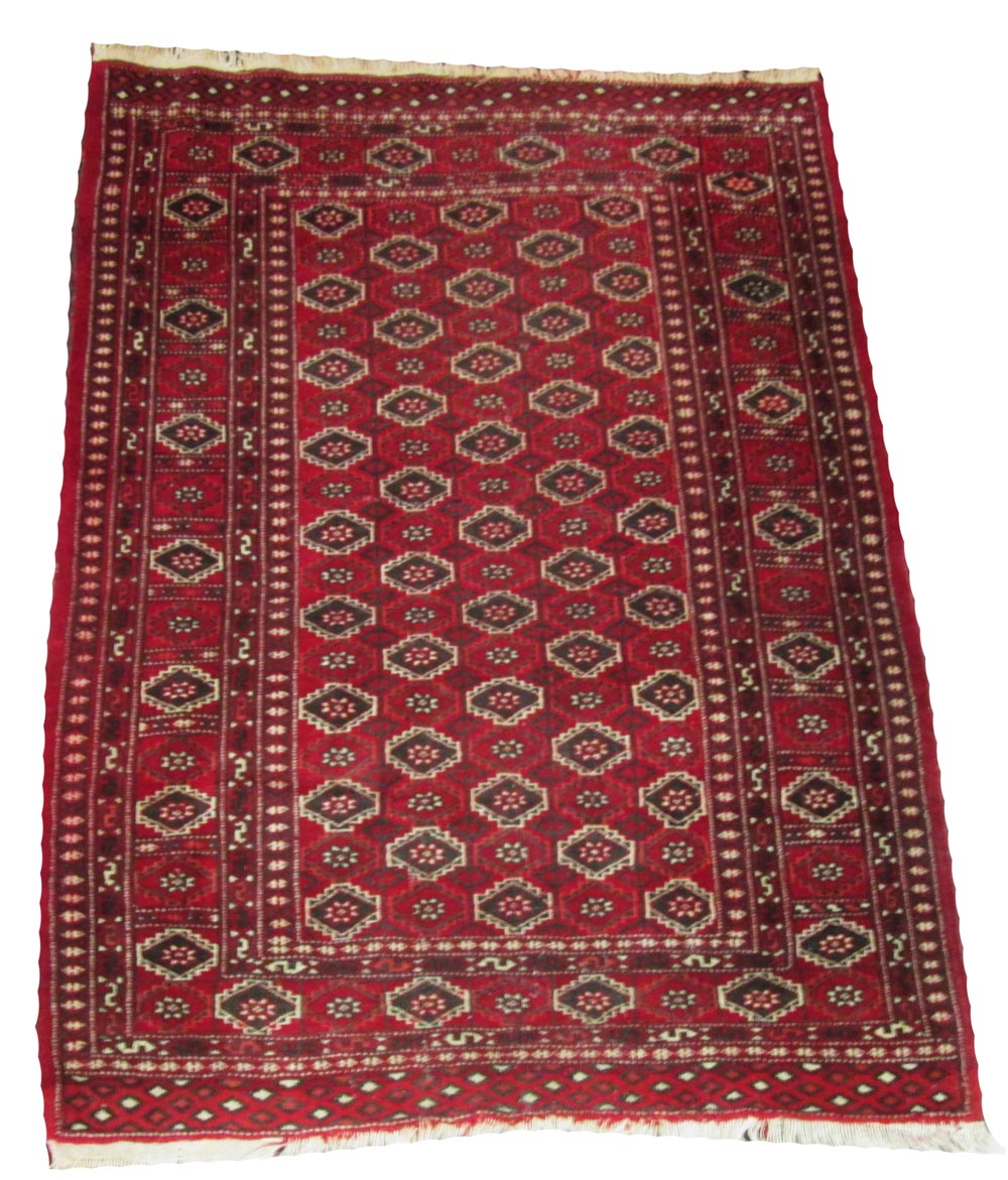 BAKHTIARI RUG, 152cm x 113cm, all over motifs on a rouge field within corresponding border.