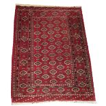 BAKHTIARI RUG, 152cm x 113cm, all over motifs on a rouge field within corresponding border.