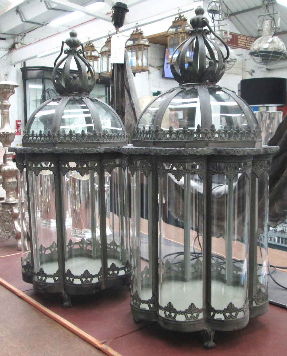 STORM CANDLE LANTERNS, a pair, 19th century style glass lined in metal frames with crown tops,