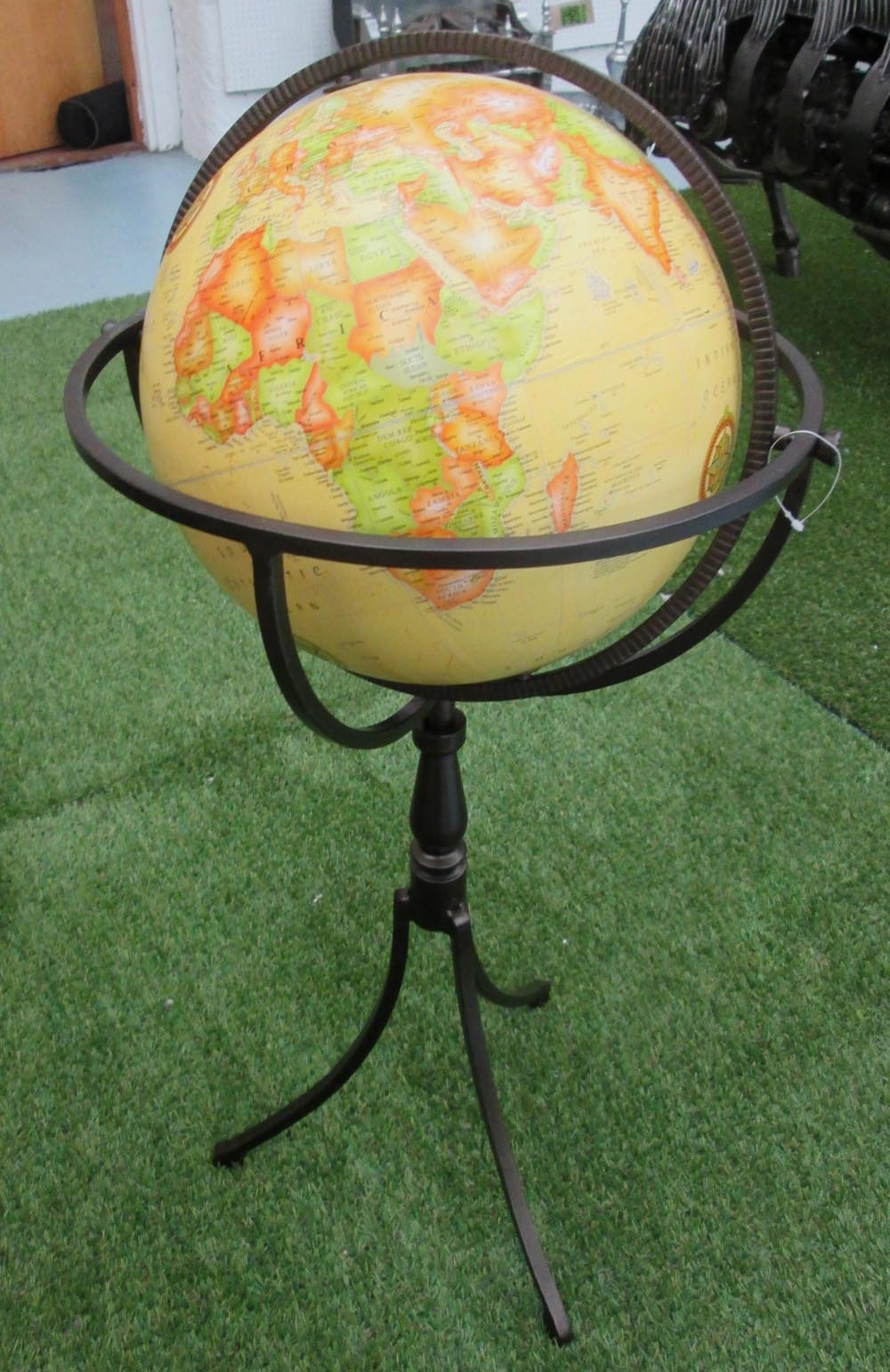 GLOBE, on a metal stand with triform support, 81cm H.