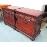 SIDE CHESTS, a pair, cherrywood carved with three small drawers below on bun supports,