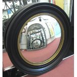 CONVEX MIRROR, the circular black frame with gilt detail, 75cm W.