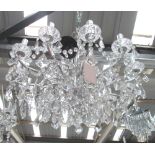 CHANDELIER, twelve branch in a distressed silvered frame with cut glass drops, 80cm W.