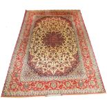FINE SIGNED ISFAHAN CARPET, 305cm x 202cm, pole medallions on an ivory field of vines,