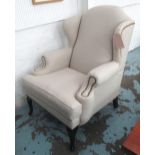 WINGBACK CHAIR, by Eichholtz in a stone coloured fabric, 81cm W x 104cm H x 81cm D.