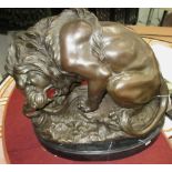 BRONZE STATUE, of a lion with snake, 46cm L.