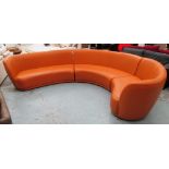 BANQUETTE SOFA, curved, brown leather, in sections, approximately 85cm H x 85cm x 385cm.