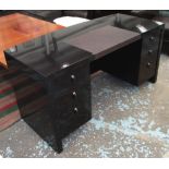DESK, of curved form, black lacquer with six small drawers below on square supports,