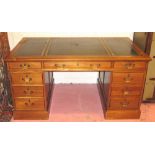 PEDESTAL DESK, early 20th century with green leather top above eight drawers,
