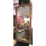 PIER MIRROR, 19th century giltwood and gesso with foliate framed narrow arched plate,