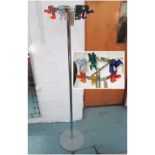 HAT/COAT STAND, metal and acrylic, the hangers in the form of figures in various colours.