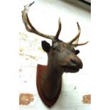 WALL PLAQUE OF A STAGS HEAD, oxidised rustic effect by Tim Poole, 72cm H.