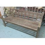 GARDEN BENCH, weathered teak slatted on square supports, 183cm L.