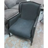 WINGBACK ARMCHAIR, French style, in black fabric on an ebonised frame, 77cm W.