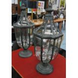 CANDLE LANTERNS, a pair, Georgian style, glass lined metal frames with hanging glass candle bowls,